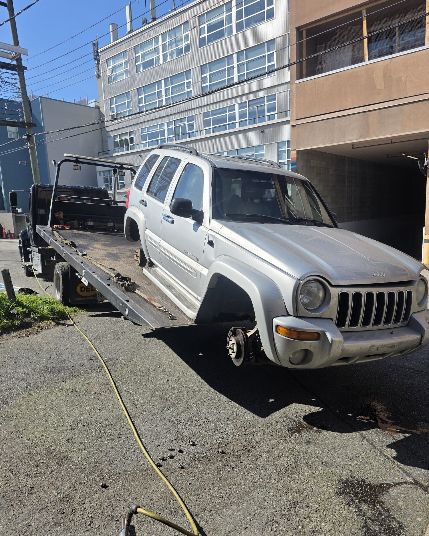 White SUV beside a commercial building